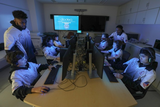 Members of Zama Middle High School&#39;s esports team gather in one of the school&#39;s computer rooms at Camp Zama, Japan, Feb. 3, 2023. The team recently wrapped up its inaugural season, which had players competing virtually against other schools in a multiplayer video game.