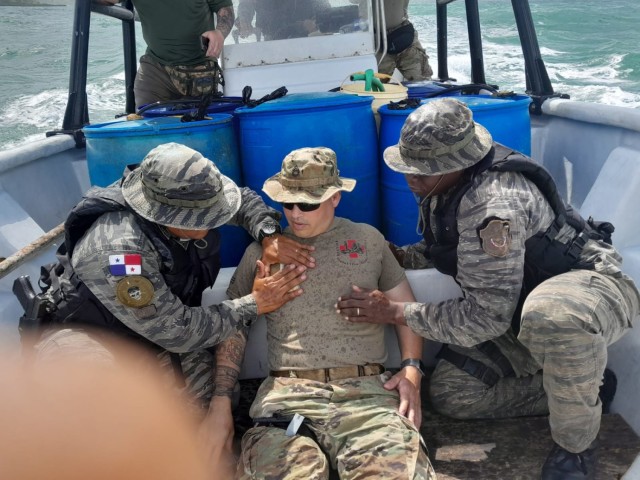 Security Assistance Training Management Organization&#39;s Sgt. 1st Class Nino Cintron plays the role of a casualty while advising Panamanian law enforcement during a riverine training exercise in Colon, Panama. The training took place on patrol vessels in riverine and maritime environments to provide the most realistic experience for the Technical Assistance Field Team&#39;s Panamanian partners. SATMO organizes and trains tailored SATs to meet security assistance mission requirements and deploys worldwide in support of Allies and Partners and geographic combatant command theater strategies. 
