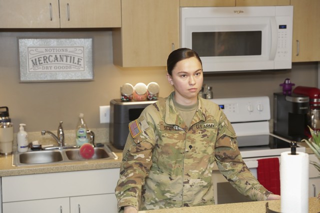 SPC Taylor Sewell, with Fort Belvoir Community Hospital, in the kitchen of her residence in McRee Barracks. Sewell said she is very impressed with the Barracks&#39; floor plan and safety.
