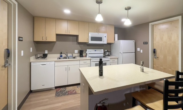 A kitchen in the newly renovated Fort Belvoir Mcree Barracks, where 4 single service members share access to stove, oven, microwave, refrigerator and dishwasher, Feb. 1. Each private room has its own heat, air conditioning, bathroom and personal...