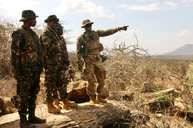 U.S. Army Capt. Nils A. Olsen, Company Commander,1st Battalion, 503rd Infantry Regiment, 173rd Airborne Brigade works with Kenyan Defence Force Soldiers during the final training event of Exercise Justified Accord, March 16, 2022.  Exercise Justified Accord allows the US and our African partners to support enduring peace and stability in the region. Over 800 personnel participated in the exercise which included a multinational field training exercise and a command post exercise Feb. 28-March 17, 2021.