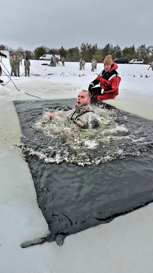 Airmen jump in icy Fort McCoy lake for January cold-water immersion training