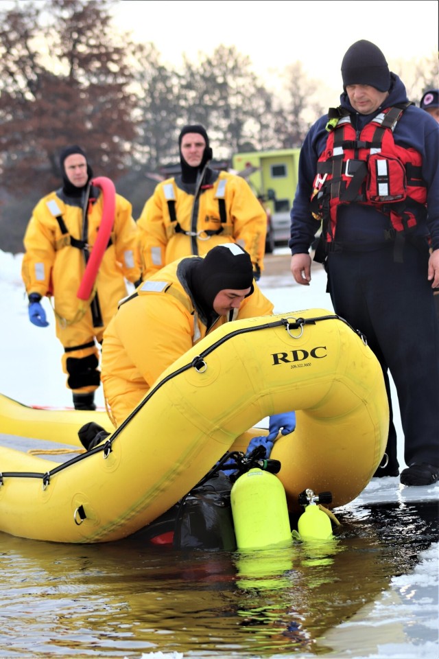 Fort McCoy Fire Department dive team conducts ice rescue training at frozen lake at Fort McCoy