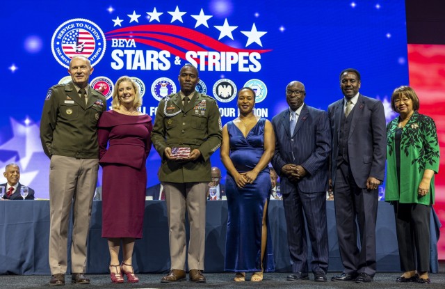 Command Sgt. Maj. LaQuaine Bess of AFC and his wife were honored by Army leaders and BEYA organizers with a Stars and Stripes Award during the 2023 BEYA STEM Conference.