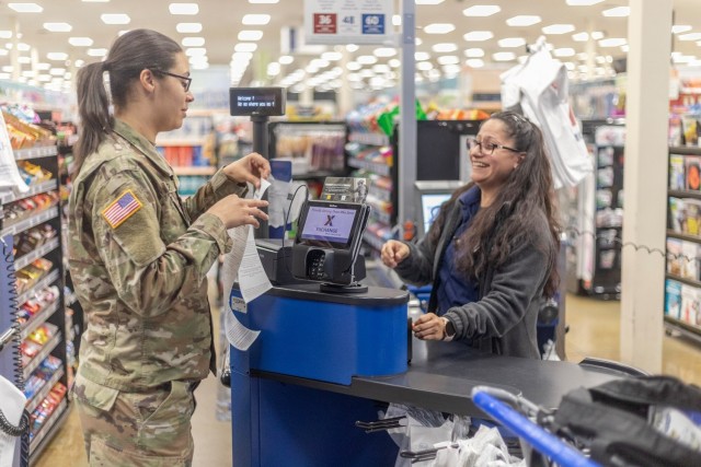 Soldier clips on: 11th ADA Bde. Soldier saves at the register, helps others