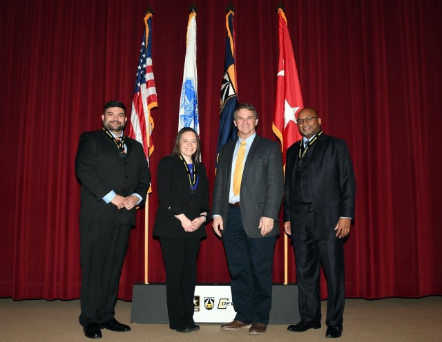 Daryoush Salehi, Katherine &#34;Kit&#34; Fry and James Bowman III are recognized by DEVCOM Aviation & Missile Center Director Jeff Langhout for their induction into the U.S. Army Combat Capabilities Development Command Leadership Development Program.