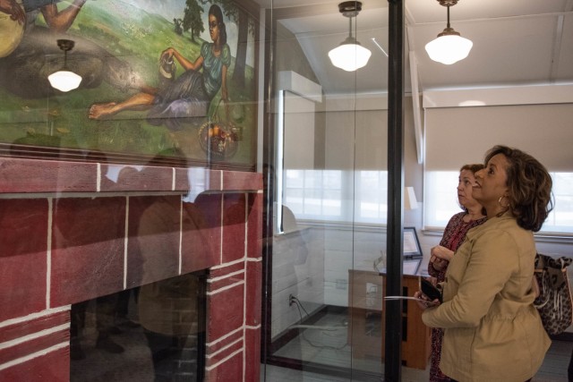 Michelle Brito, spouse of the commanding general of U.S. Army Training and Doctrine Command, Gen. Gary Brito, looks at a mural painted by the late artist Staff Sgt. Samuel Countee during a visit to Fort Leonard Wood on Wednesday.