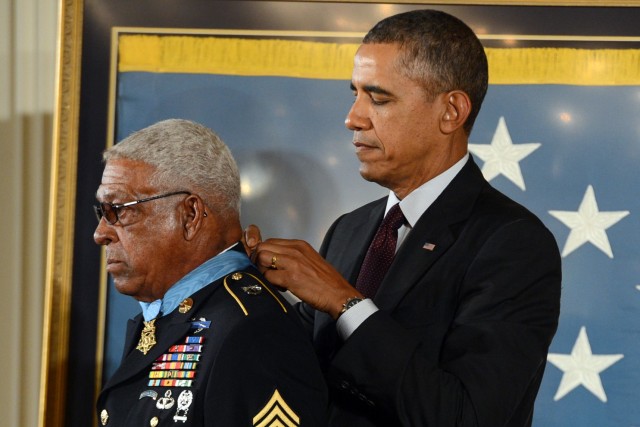 President Barack Obama awards the Medal of Honor to Army Sgt. First Class Melvin Morris during a ceremony at the White House, March 18, 2014. Morris received the medal for his actions during combat operations against an armed enemy in the vicinity of Chi Lang, Vietnam, Sept 7, 1969. At that time, he was a staff sergeant and commander of a strike force drawn from Company D, 5th Special Forces Group, 1st Special Forces.
