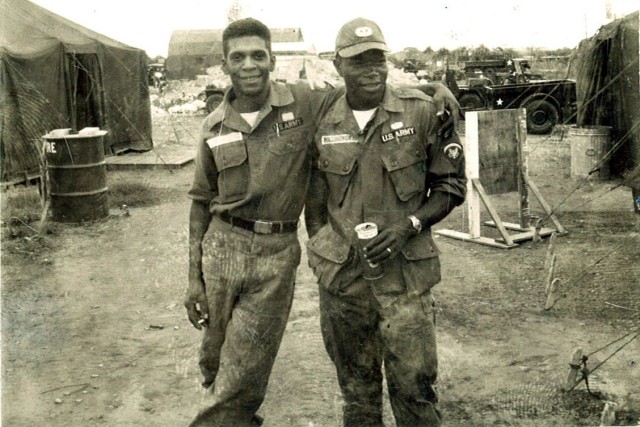 Army Sgt. 1st Class Melvin Morris, left, poses for a photo with a friend while in the field in Vietnam. Morris earned the Medal of Honor in 2014 for actions he took there on Sept. 17, 1969.
