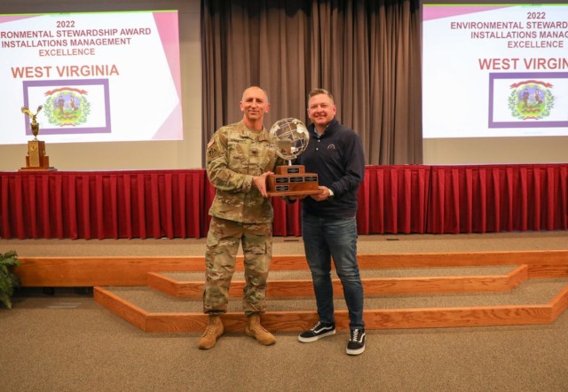 Col. Anthony Hammett, the Army National Guard’s chief of installations, environment, and energy, left, presents the 2022 Environmental Stewardship Award to Nick Broyles, accepting on behalf of the West Virginia Army National Guard&#39;s environmental program, during the Programming Guidance Course at the Professional Education Center on Camp Robinson in North Little Rock, Arkansas, in January 2023. The WVARNG scored highest in the nation in the ARNG G-9’s four environmental sections: Cleanup, Conservation, Technological Innovation, and Planning.
