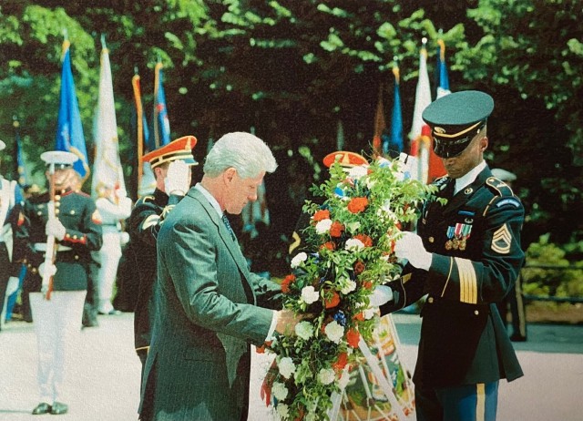 Hardney assist Clinton with wreath