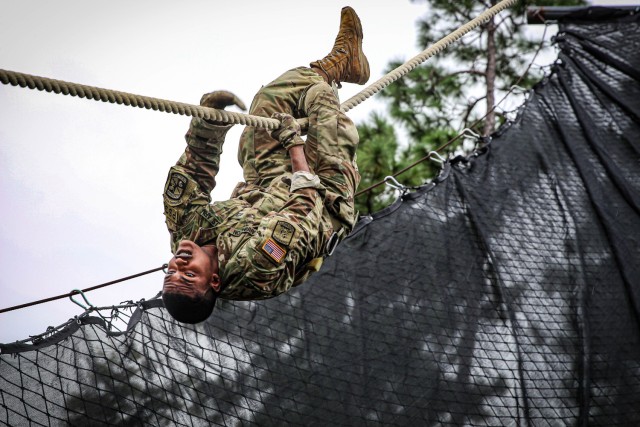 A Tuskegee University Army ROTC cadet slides down the inverted rope descent during an FTX at Fort Benning, GA, on September 19, 2020.