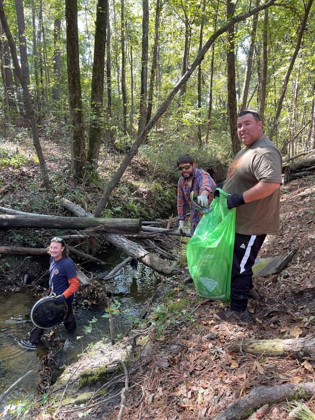 Fort Jackson community members clean up around the water system areas on post Oct. 14. The cleanup helps to keep contaminants out of the post water supply and echo system. Lisa Mcknight, Fort Jackson environmental scientist said cleaning up the...