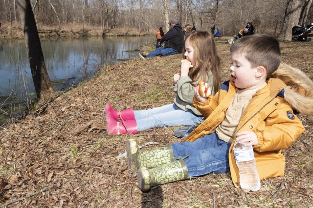 It’s time for a hotdog break for 3-year-old Ian and 4-year-old Emerson Smith at Saturday’s Youth Trout Fishing Derby at Stone Mill Spring. The derby was organized by the Directorate of Public Works’ Natural Resources Branch and the Outdoor Adventure Center, in cooperation with the U.S. Forest Service and the Missouri Department of Conservation. 