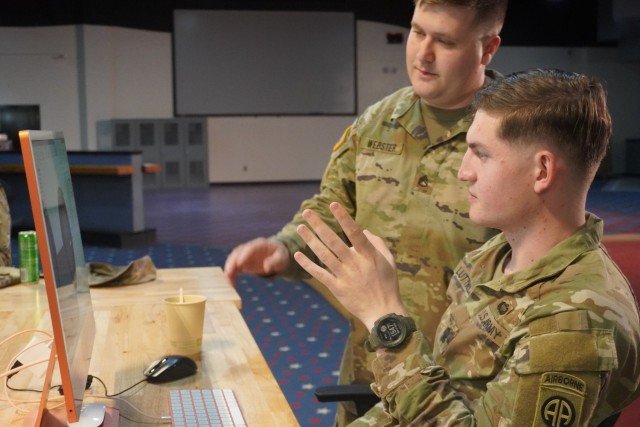               SSG Webster, Additive Manufacturing Lead and instructor, discussing design plans with SPC Luttrell.               