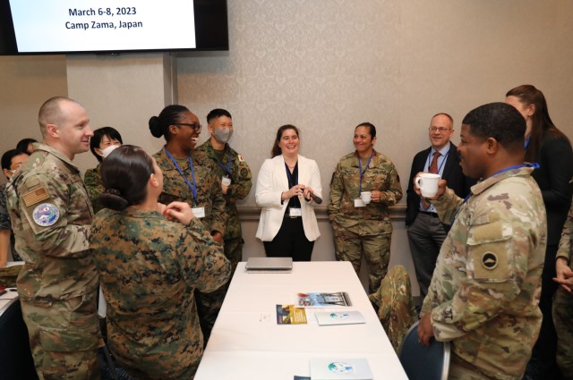 Participants in the U.S. Army Japan&#39;s inaugural Women, Peace and Security symposium share a laugh during an icebreaker game inside the Camp Zama Community Club, Japan, March 6, 2023. The three-day event had speakers, panel discussions and...