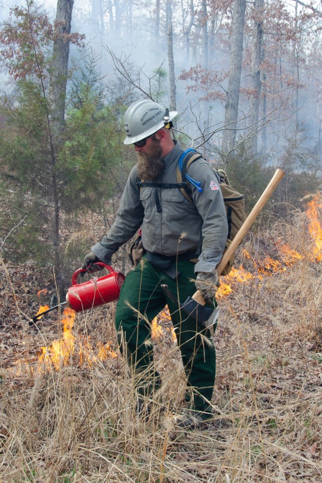 Army veteran Sam Bowen, Mark Twain Veteran Crew captain, participates in a prescribed burn on March 1 at Cannon Range. More than 50 people from fire crews across the country participated in the 4,000-acre burn to benefit the range and prevent a...