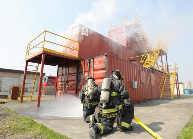 Smoke billows from a new live-fire training facility during a scenario at Sagami General Depot, Japan, March 9, 2023. After being trained by contractors on the facility earlier this year, the U.S. Army Garrison Japan fire department has recently begun to train its own personnel on the proper ways to handle indoor fires.