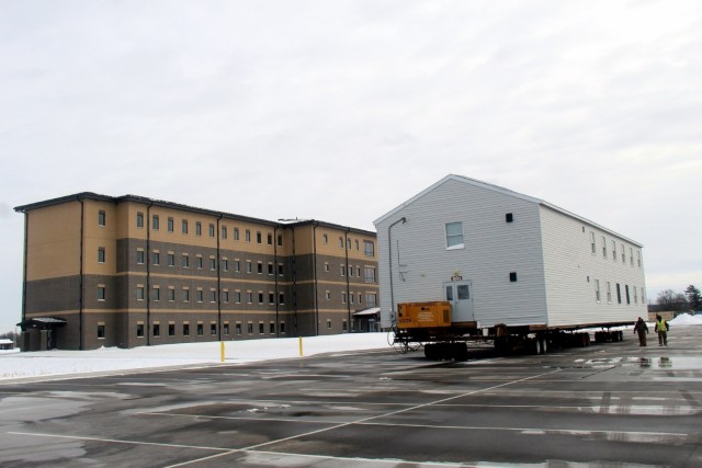 History made: Contractor moves first two World War II-era barracks at Fort McCoy