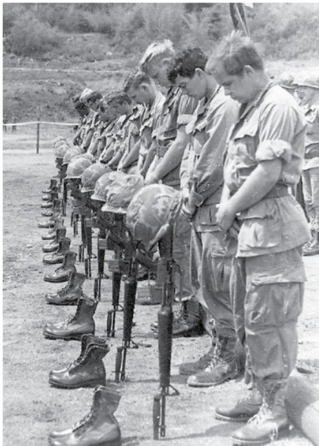 Service members hold a memorial service in Vietnam. 