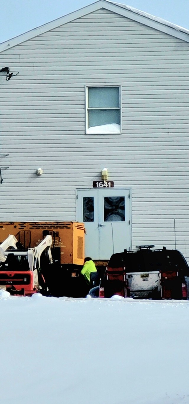 Contractors prepare World War II-era barracks buildings to be moved at Fort McCoy