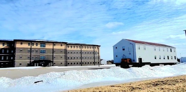Contractors move second World War II-era barracks building at Fort McCoy