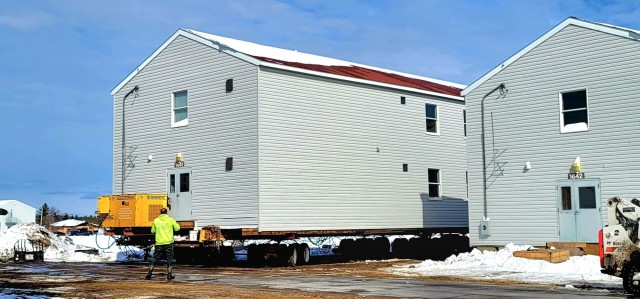 Contractors prepare World War II-era barracks buildings to be moved at Fort McCoy