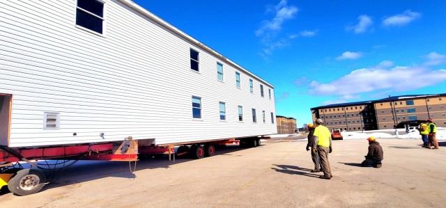 Contractors move second World War II-era barracks building at Fort McCoy