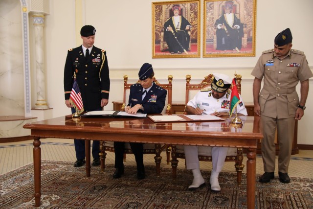 Maj. Gen. Kerry Muehlenbeck, commander of the Arizona National Guard, seated at left, signs an official partnership decree with Vice Admiral Abdullah bin Khamis Al-Raisi, chief of staff of the Sultan&#39;s Armed Forces, during a ceremony in Muscat, Oman, solidifying Oman as a partner with the state of Arizona under the State Partnership Program. The SPP links a state’s National Guard with armed forces of a partner country in a cooperative, mutually beneficial relationship.