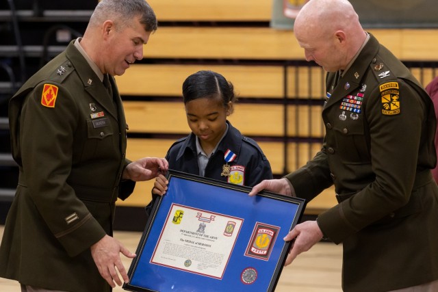 Army JROTC Cadet C’Azia Hamilton, Kirby High School, is awarded the Medal of Heroism, the highest honor an Army ROTC or JROTC Cadet can receive, during a competition at North Hardin High School, Radcliff, Ky., March 11, 2023. Last November, Hamilton provided life-saving first aid to a fellow student who was shot right next to her school. | Photo by Kyle Crawford, U.S. Army Cadet Command Public Affairs