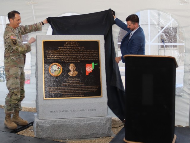 Military Deputy to the Assistant Secretary of the Army for Acquisition, Logistics and Technology, Lt. Gen.  Robert L. Marion (left) and Program Executive Officer for Intelligence, Electronic Warfare and Sensors Mr. Mark C. Kitz (right) unveil a plaque honoring Maj. Gen. Greene in a rededication ceremony at Aberdeen Proving Ground, Maryland.