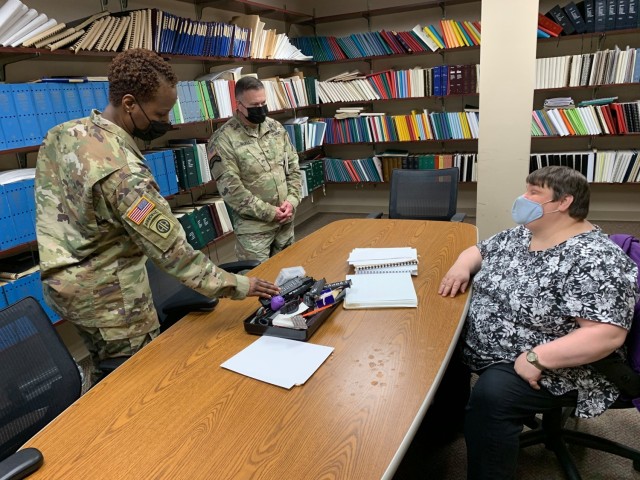 (From left) APG Garrison Command Sgt. Maj. Ruth Drewitt and Garrison Commander Col. Timothy Druell discuss the blind rehabilitation program with Braille instructor Jennifer Bopp.