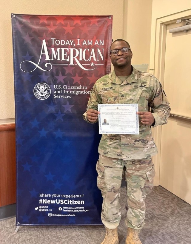 Sgt. Osse Jeanpierre shows off his official U.S. citizenship certificate following his swearing in as a U.S. citizen Dec. 15, 2022, in Tukwila, Wash. Jeanpierre and his family left Haiti when he was 9 years old. (Courtesy Photo)