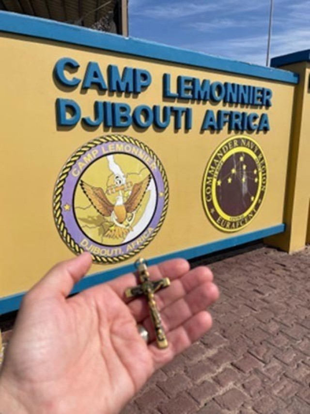 New York Army National Guard Lt. Col. Shawn Tabankin, the commander of the 1st Battalion, 69th Infantry, holds the &#34;Kilmer Cross&#34; at Camp Lemonnier, Djibouti, where the battalion is stationed while on duty at locations in the Horn of Africa. The crucifix was the property of poet Joyce Kilmer, who died while serving in the 69th Infantry in World War I.  (Courtesy photo)