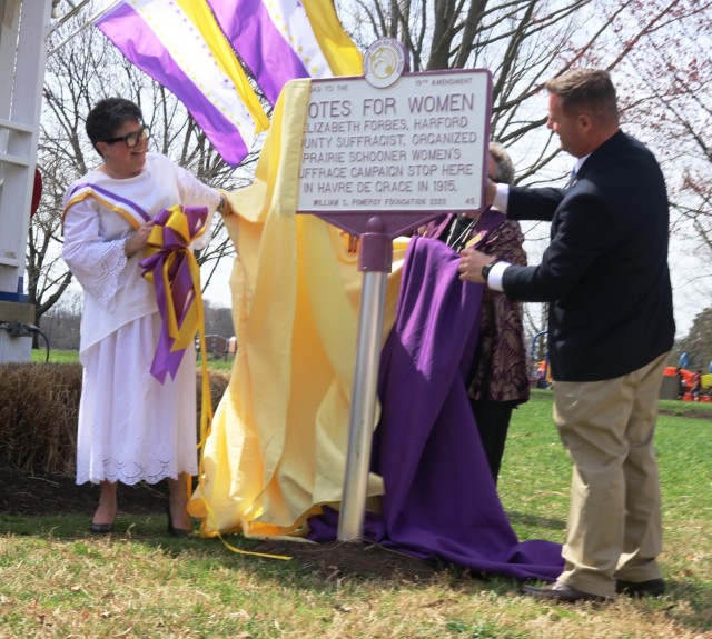 Amy Rosenkrans and Havre de Grace Mayor Bill Martin unveil a new historical marker dedicated to the contributions of Elizabeth Forbes, a Harford County suffragette