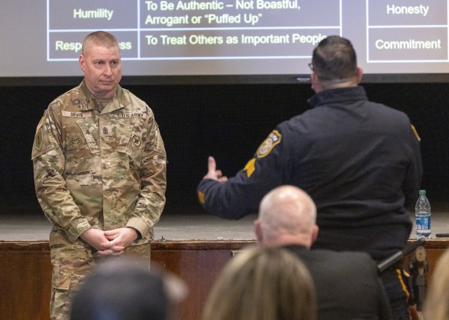 A sergeant with the Picatinny Arsenal Police Department asks a question of Sgt. Maj. Larry H. Orvis Jr., U.S. Army Inspector General Sergeant Major, during a leadership series presentation at Picatinny Arsenal on March 9.