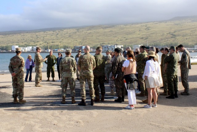 U.S. Army Garrison Pōhakuloa Training Area Garrison (PTA) Commander Lt. Col. Kevin Cronin briefing foreign military attachés and their spouses at Kawaihae Harbor where troops and equipment are shipped from Oahu to conduct training at PTA, March...