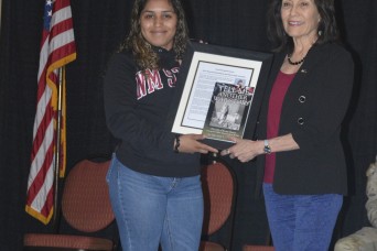 Margaret Garcia, daughter of Bataan Death March survivor Evans Garcia Ramirez, presented the Evans Garcia Ramirez ROTC Scholarship to New Mexico State U...