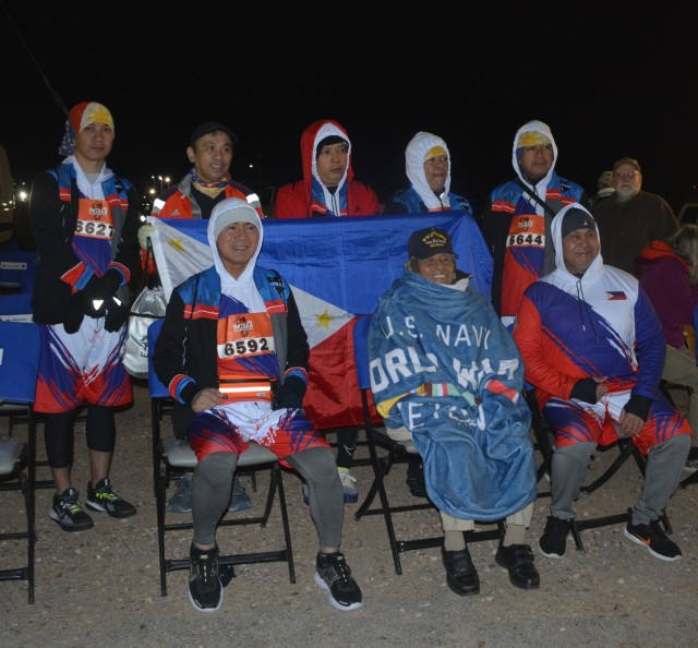 Among those in attendance was Bataan Death March survivor Valdemar DeHerrera, 103, front center, who was joined by Undersecretary Administrator of the Filipino Veteran Affairs Office Reynaldo B. Mapagu, front left, and members of the delegation...