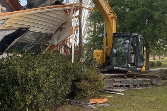 With a push from an excavator and a blast of dirt, a piece of Fort Stewart’s past was demolished March 15 to make way for future improvements here.