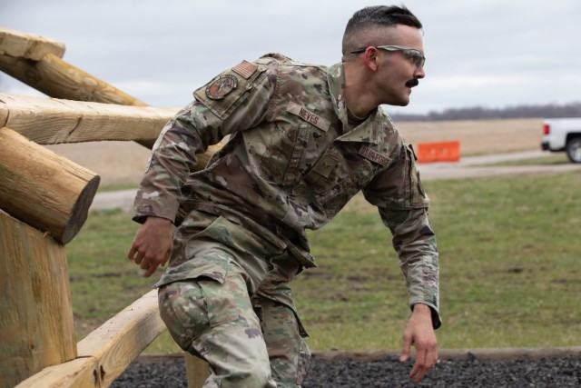 Senior Airman Evan Nieves, with the 122nd Fighter Wing, sprints through the obstacle course during the Best Warrior Competition at Camp Atterbury, Ind., March 17, 2023. Service members from the Indiana National Guard and the Slovakian armed forces tested basic Soldier skills like physical fitness, marksmanship and combat readiness in the three-day competition. (U.S. Army photo by Sgt. Hannah Clifton)