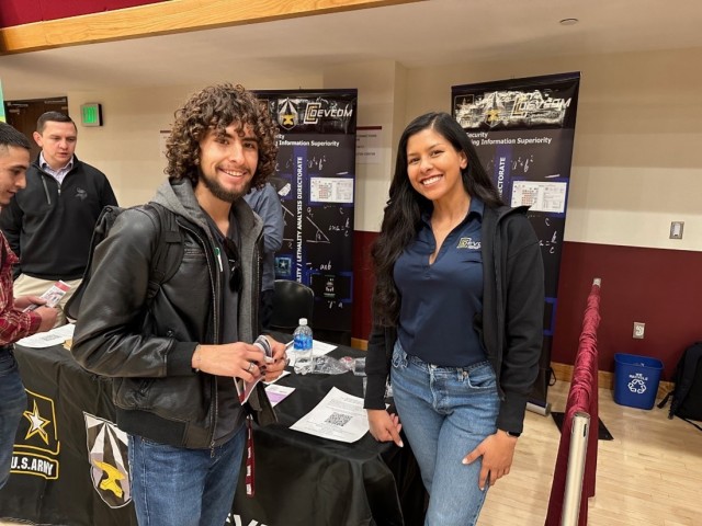 Herandy Vasquez (right) shares information with students at the New Mexico State University Career Fair about upcoming opportunities at DEVCOM Analysis Center in STEM-related fields.