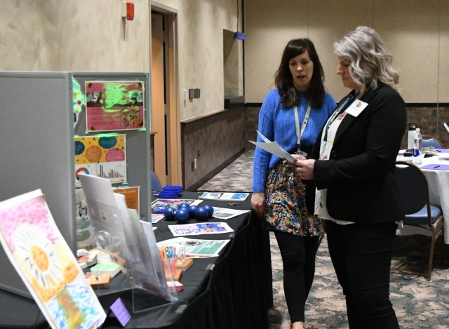Nicole Wetzel, a Family Advocacy Program educator with the Fort Drum Soldier and Family Readiness Division, talks with members of the Fort Drum Educational Liaison Committee about the variety of programs on post for military families. The Fort...