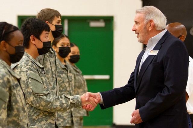 Civilian Aide to the Secretary of the Army Joseph Bray greets John B. Connolly High School JROTC Cadets during a community outreach event in Pflugerville, Texas.