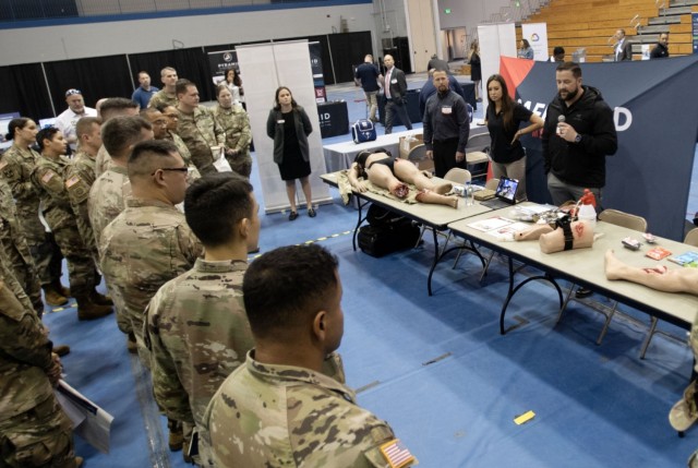 Fort Jackson Soldiers listen to exhibitors explain their products during the Fort Jackson Industry Day, March 14. 