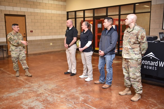 Col. Anthony Pollio, U.S. Army Garrison Fort Leonard Wood commander, welcomes four of the six neighborhood mayors in attendance at Tuesday’s town hall at Stonegate Community Center. From left: this year's mayors are Eric Hawes, for North...