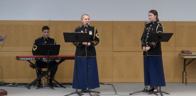 Members of The U.S. Army Band &#34;Pershing&#39;s Own,&#34; sing musical selections during the Women’s History Month observance hosted by the Joint Task Force-National Capital Region and the U.S. Army Military District of Washington at the National Defense University’s Lincoln Auditorium on Fort McNair, DC, Friday, March 17, 2023. 