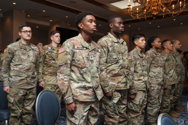 Nearly 20 noncommissioned officers participate in an NCO induction ceremony at the Camp Zama Community Club, Japan, March 22, 2023. The ceremony was hosted by the 78th Signal Battalion and U.S. Army Aviation Battalion Japan.