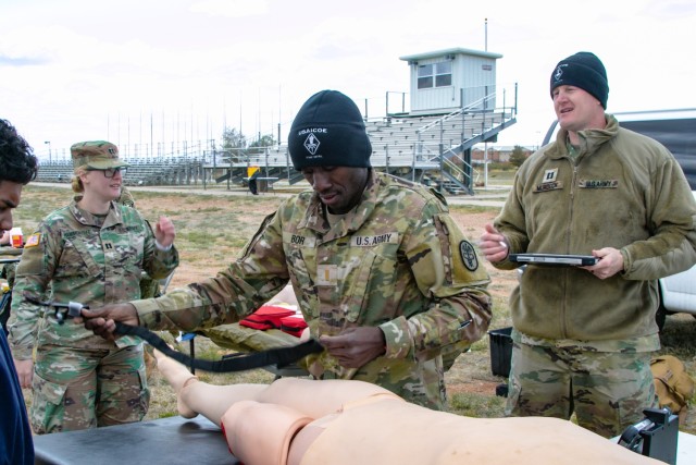 2nd Lt. Emmanuel Bor, U.S. Army Medical Department Activity (MEDDAC), demonstrates buddy aide techniques for students March 24. Bor had the opportunity to share some of his background with them during the &#34;Day in the Life&#34; recruiting event. (U.S. Army photo by Sgt. 1st Class Kelvin Ringold)