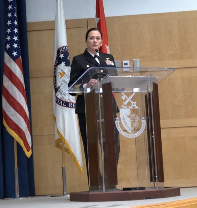 Rear Admiral Nancy S. Lacore, the Naval District of Washington Commandant, speaks during the Women’s History Month observance hosted by the Joint Task Force-National Capital Region and the U.S. Army Military District of Washington at the National Defense University’s Lincoln Auditorium on Fort McNair, DC, Friday, March 17, 2023. The program acknowledges the pioneering women, past and present, as important contributors to the achievements of the military services and civilian workforce. 